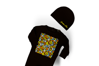 Dottie Lou Brush Pop boys baby footie pajama with matching hat in black with blue and yellow squiggle doodle print - flatlay product photo
