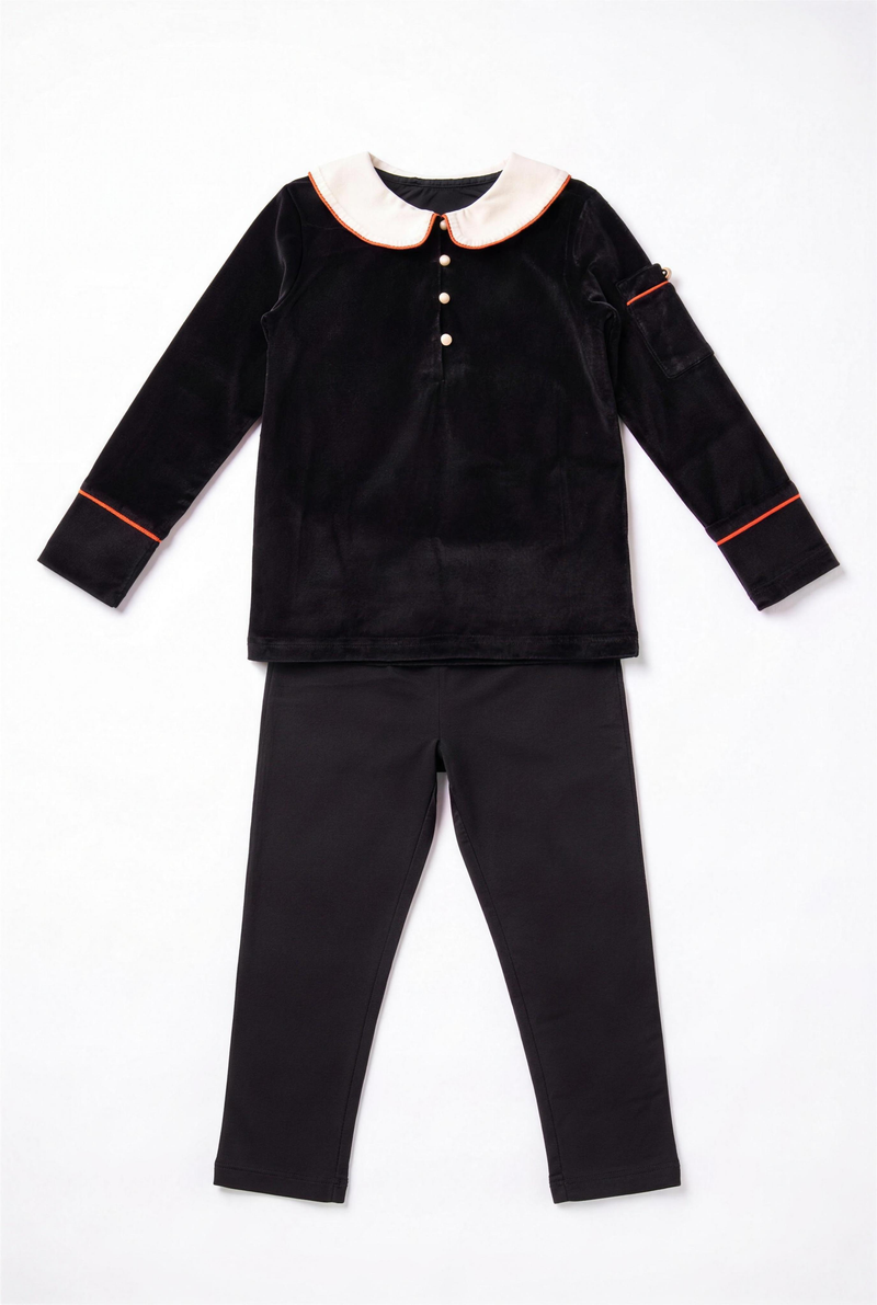 Dottie Lou Classic Noir boys 2-piece black velour lounge set with orange trim — flatlay