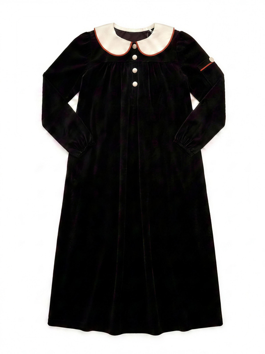 Dottie Lou Classic Noir girls black velour maxi nightgown with ivory Peter Pan collar, terracotta piping and cream knit buttons — flat lay product photo