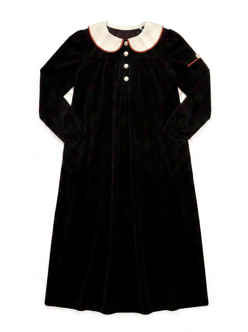 Dottie Lou Classic Noir girls black velour maxi nightgown with ivory Peter Pan collar, terracotta piping and cream knit buttons — flat lay product photo