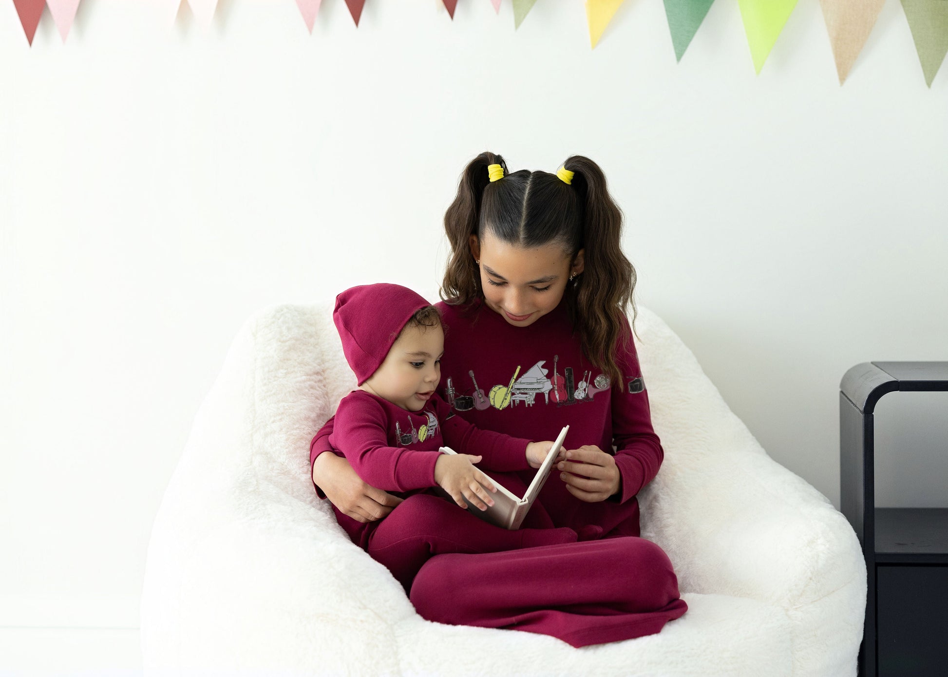 Kids in matching Dottie Lou Melody berry and moss green pajamas with music print — family photo 12