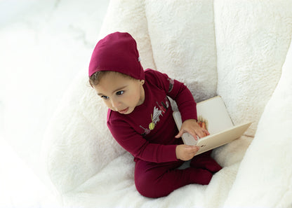 Child in Dottie Lou Melody pajamas with music print — solo child model photo 13