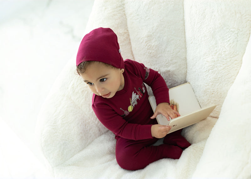 Child in Dottie Lou Melody pajamas with music print — solo child model photo 13